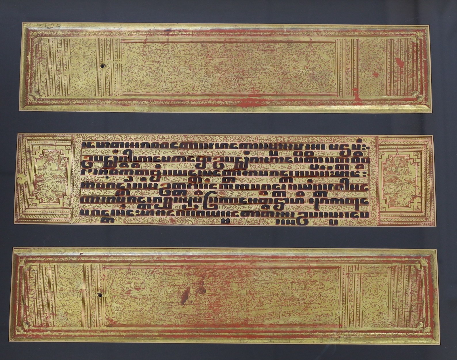 Three framed Buddhist mantras